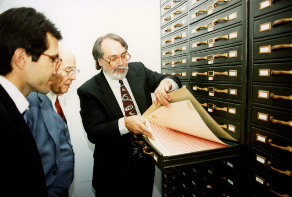 Don Sundman and his father Maynard viewing the unique certified plate proof collection at the National Postal Museum.